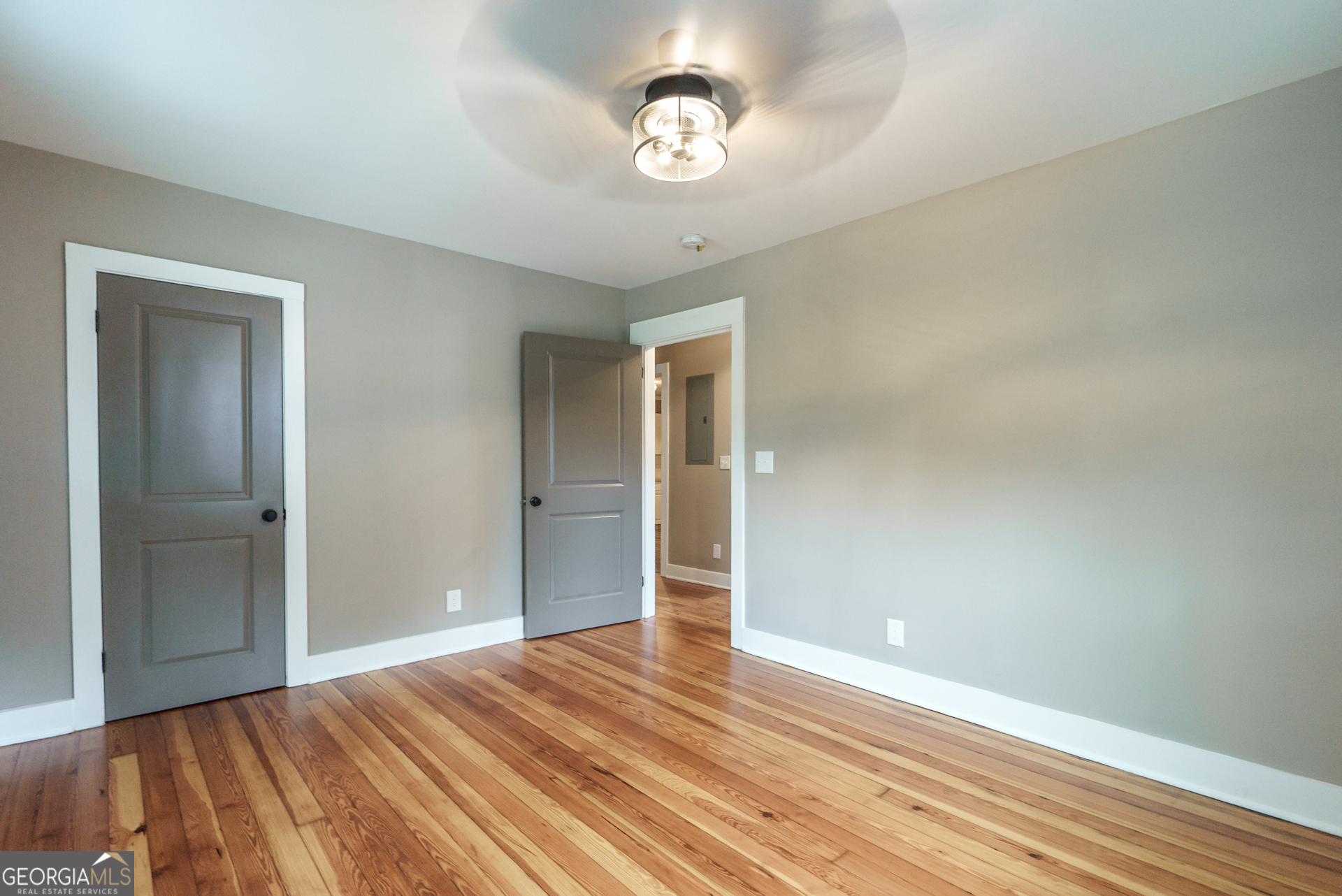 175 East Main Street, Unit B Rutledge, GA 30663 - Photo 25 of 28 a view of empty room with wooden floor