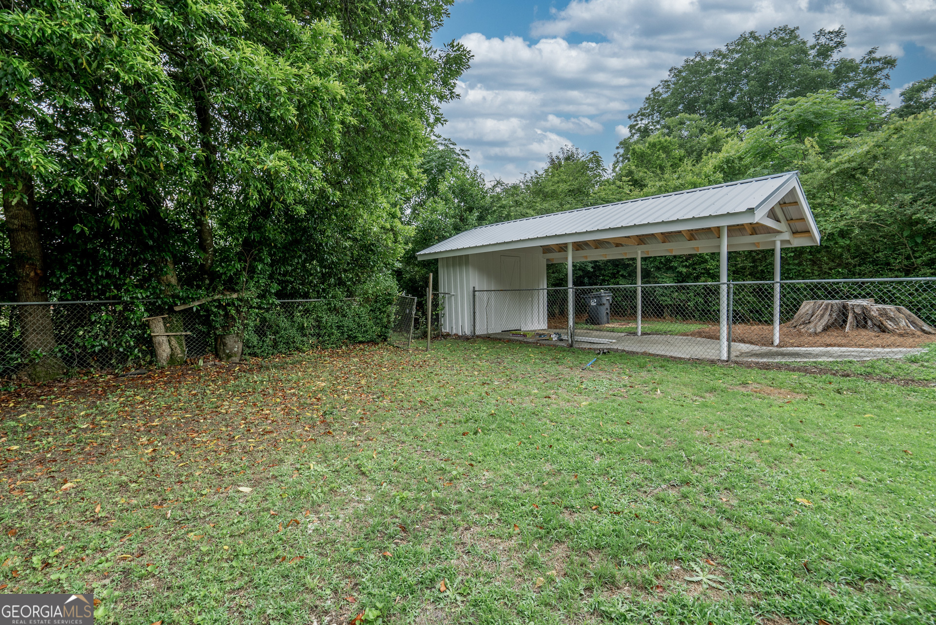 175 East Main Street, Unit B Rutledge, GA 30663 - Photo 5 of 28 a house with trees in the background