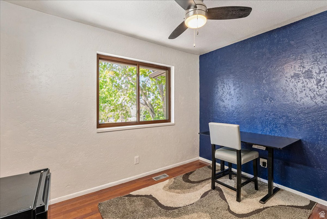 11 South Clark Lane Elk Ridge, UT 84651 - Photo 20 of 46 Office space with a textured wall, wood finished floors, a ceiling fan, and a textured ceiling