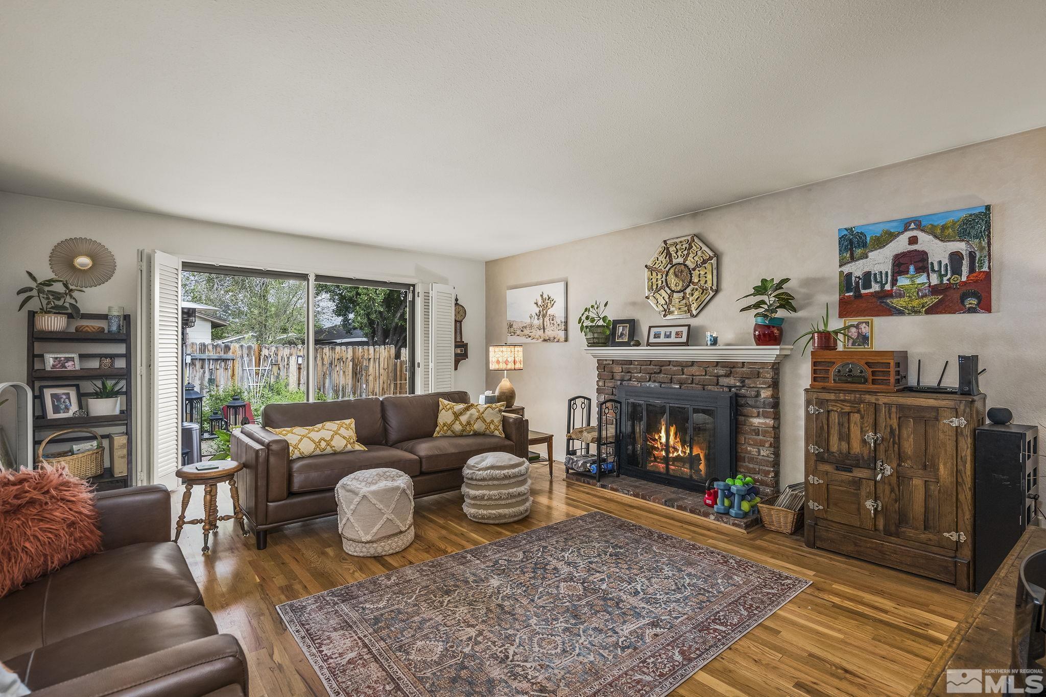 1985 Windsor Way Reno, NV 89503 - Photo 1 of 16 a living room with furniture and a fireplace