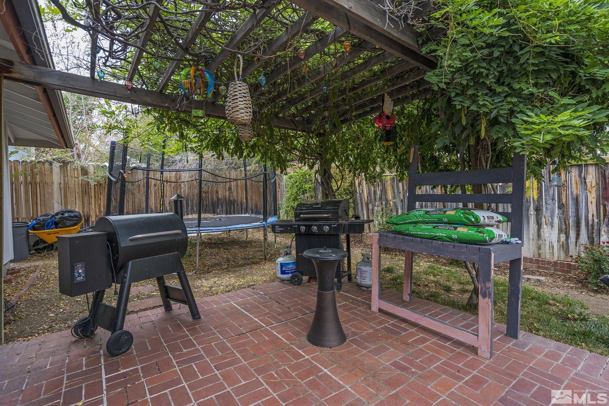 1985 Windsor Way Reno, NV 89503 - Photo 15 of 16 a view of a chairs and tables in the backyard