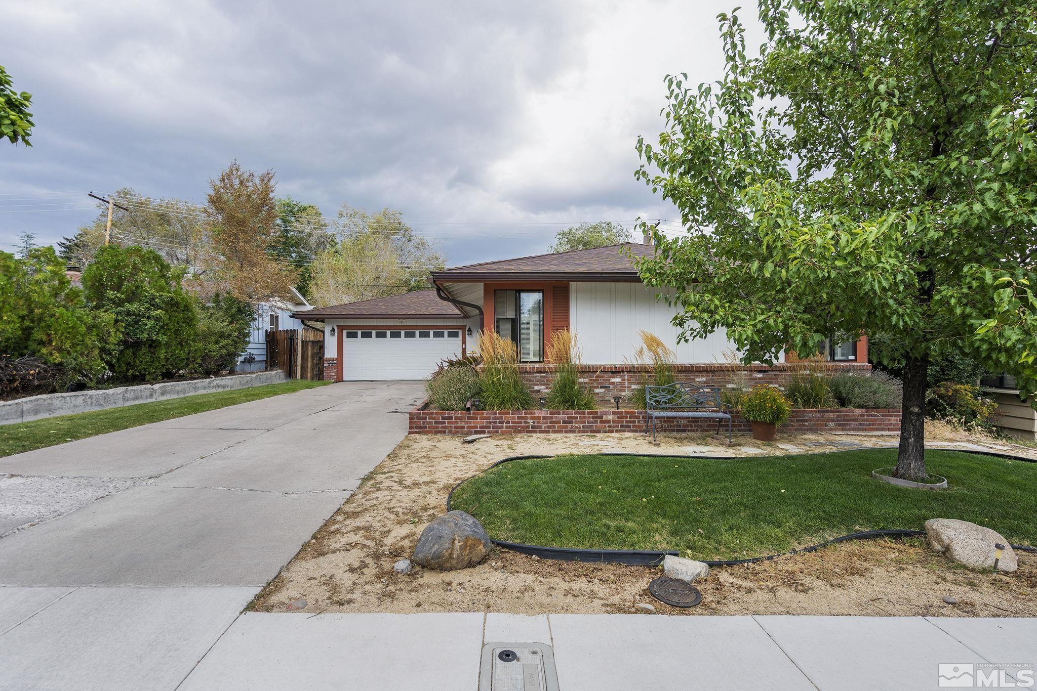 1985 Windsor Way Reno, NV 89503 - Photo 16 of 16 a front view of a house with garden