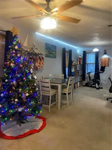 a room with lots of flowers and a table