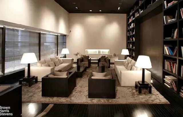 a large pool table with chairs