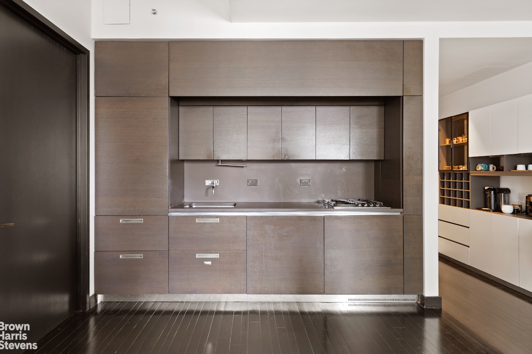 20 Pine Street, Unit 2706 Manhattan, NY 10005 - Photo 2 of 18 a refrigerator freezer sitting inside of a kitchen