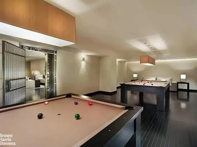 a swimming pool with outdoor seating