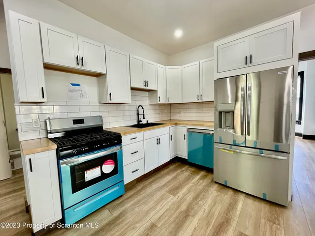 a view of a livingroom with wooden floor