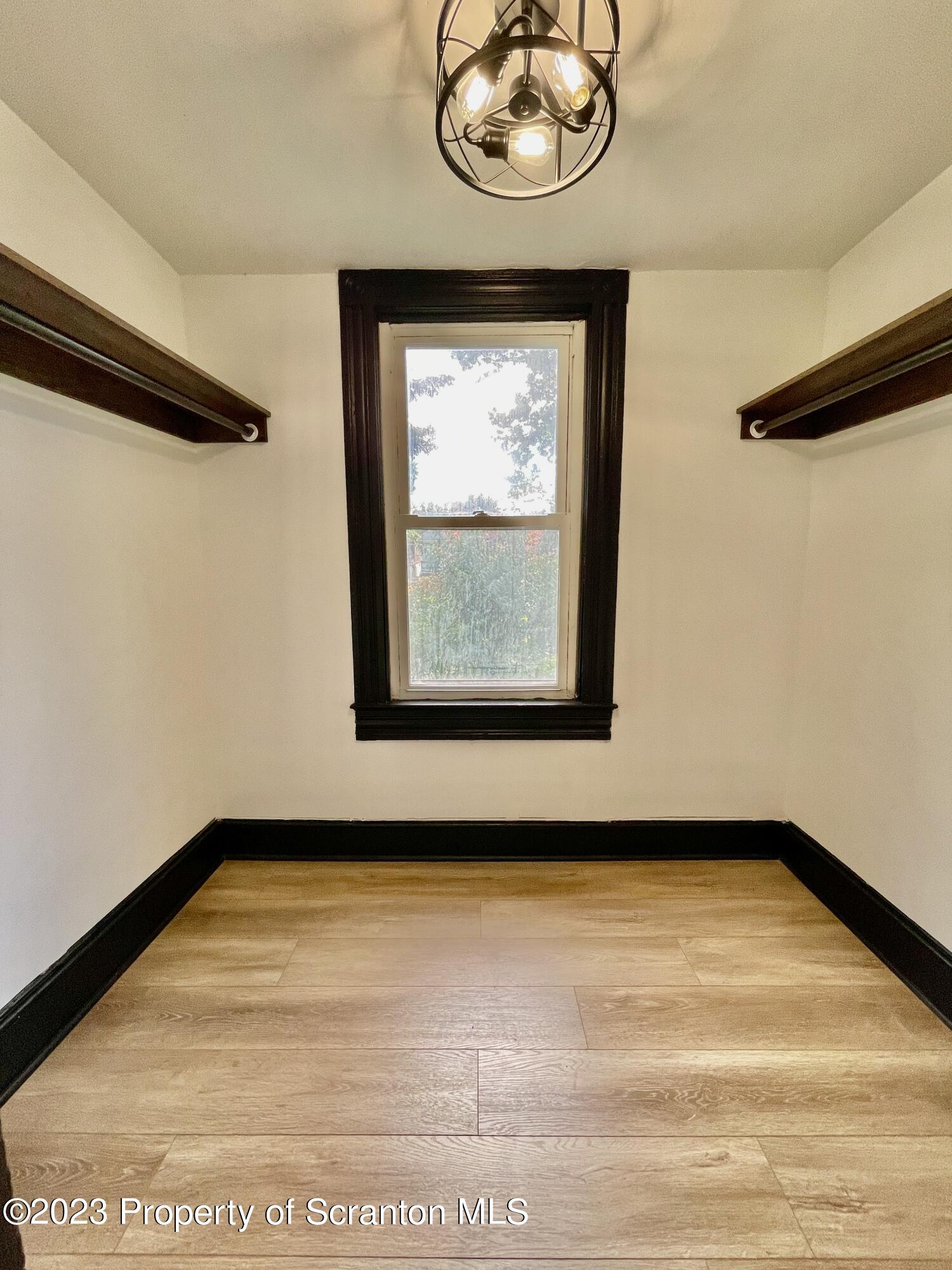 1216 Marion Street Scranton, PA 18509 - Photo 25 of 37 a view of a room with wooden floor and small window