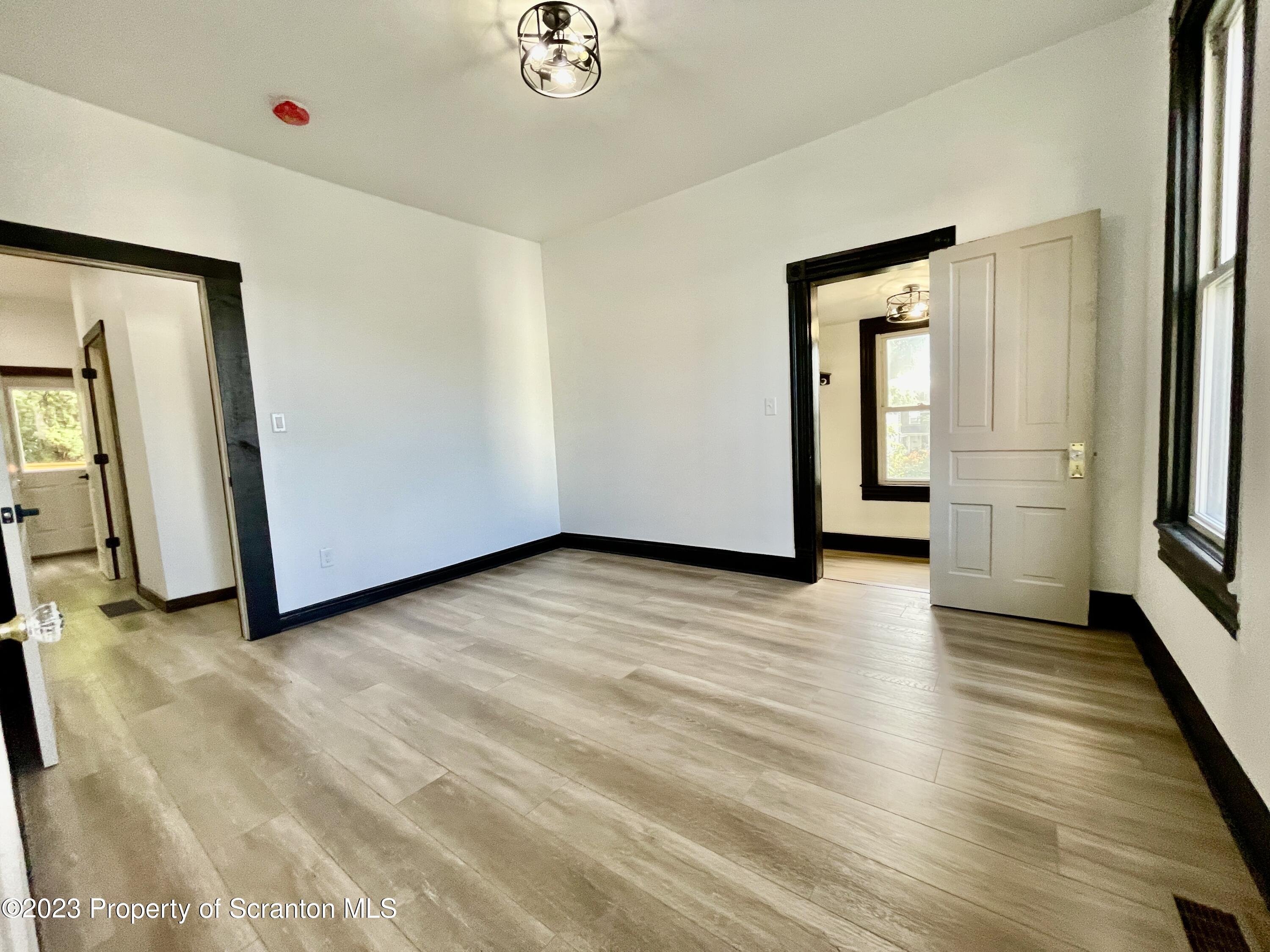 1216 Marion Street Scranton, PA 18509 - Photo 26 of 37 a view of a livingroom with wooden floor