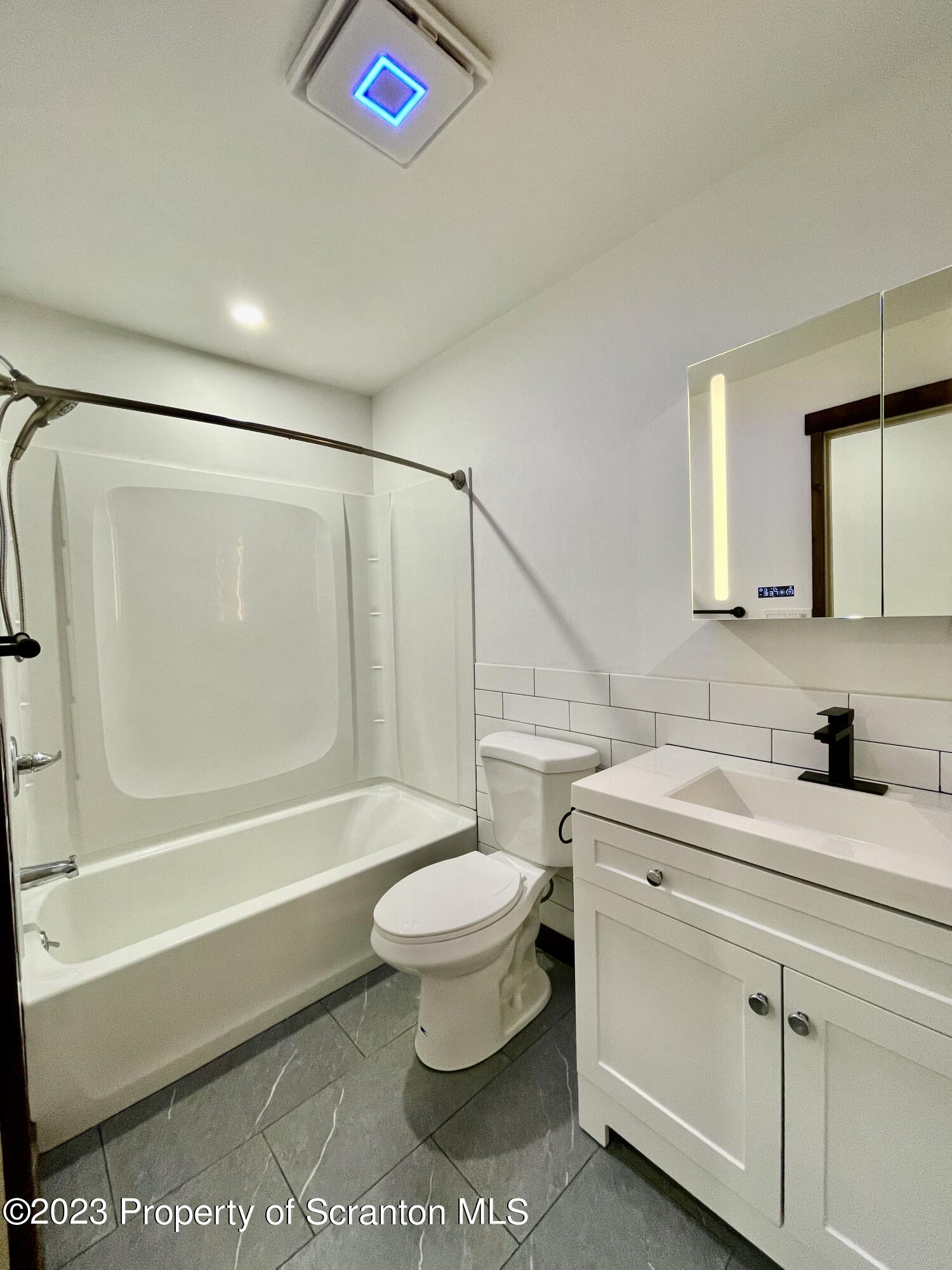1216 Marion Street Scranton, PA 18509 - Photo 27 of 37 a bathroom with a sink toilet and shower