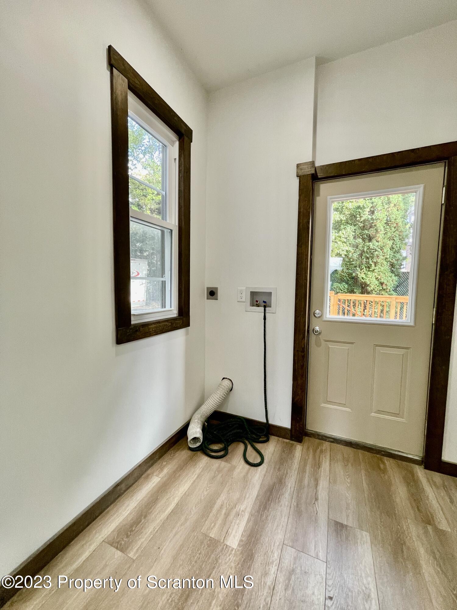 1216 Marion Street Scranton, PA 18509 - Photo 29 of 37 a view of an empty room with wooden floor and a window
