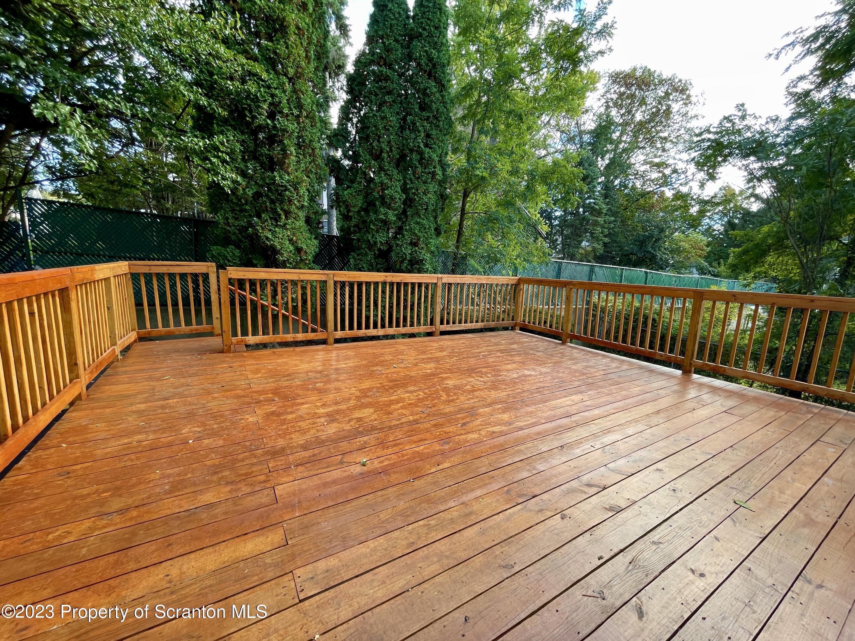 1216 Marion Street Scranton, PA 18509 - Photo 31 of 37 a view of balcony with wooden floor and fence