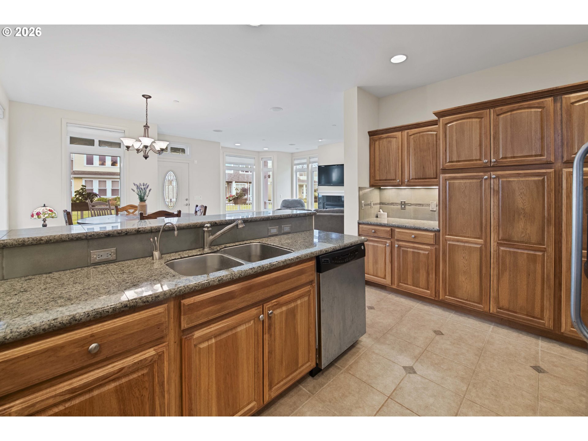 230 Round House Road Astoria, OR 97103 - Photo 16 of 43 a kitchen with granite countertop a sink stainless steel appliances and cabinets