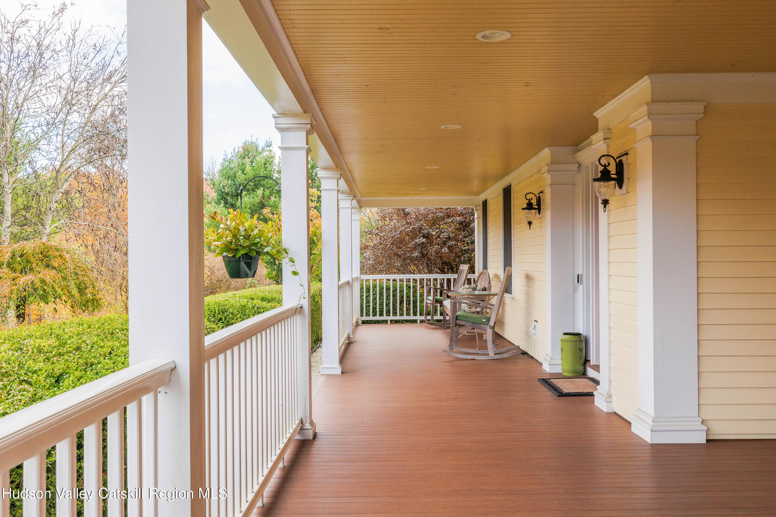 189 Sutherland Road Valatie, NY 12184 - Photo 12 of 94 a view of a porch with chairs and wooden fence