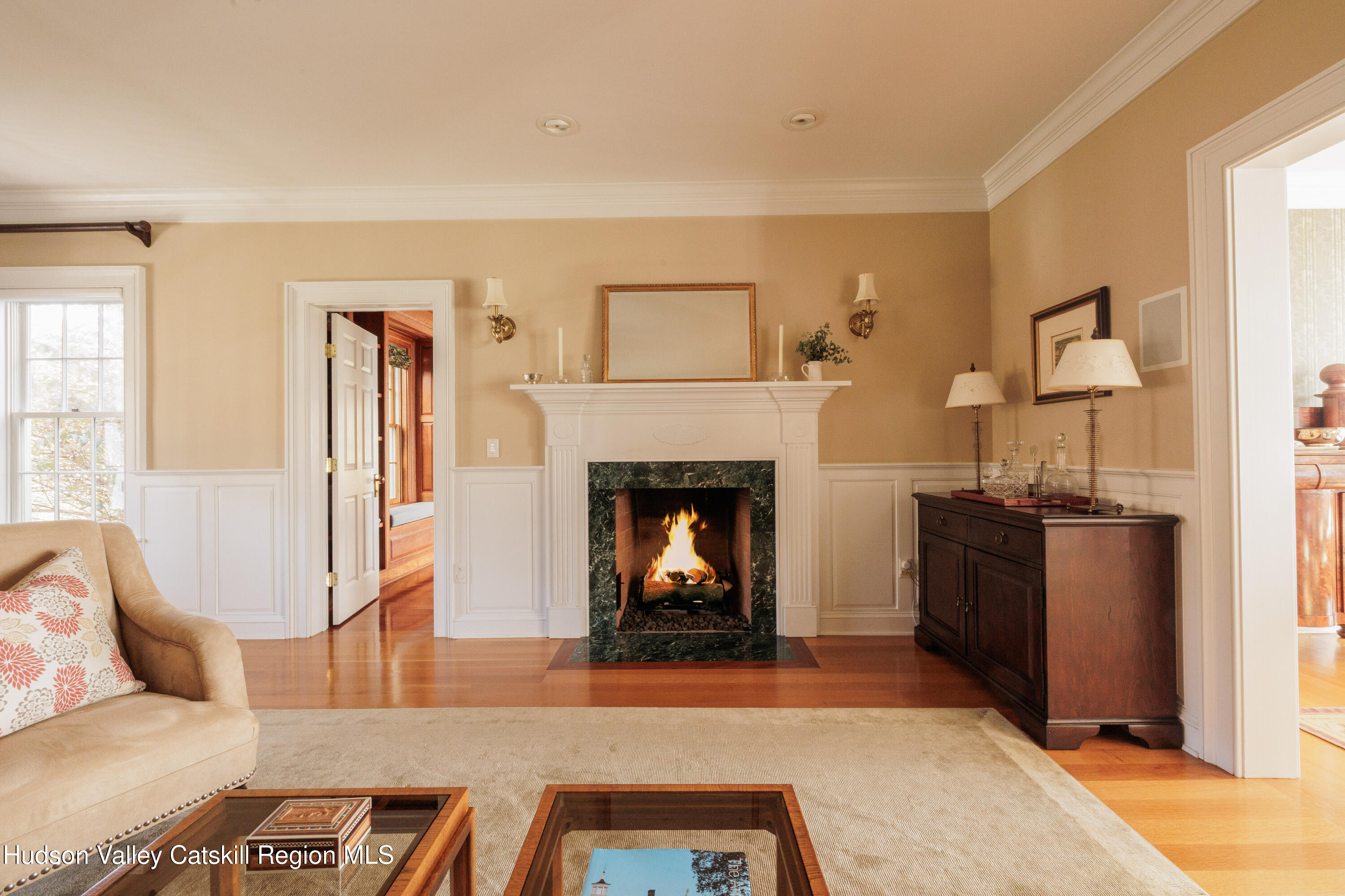 189 Sutherland Road Valatie, NY 12184 - Photo 16 of 94 a living room with furniture and a fireplace