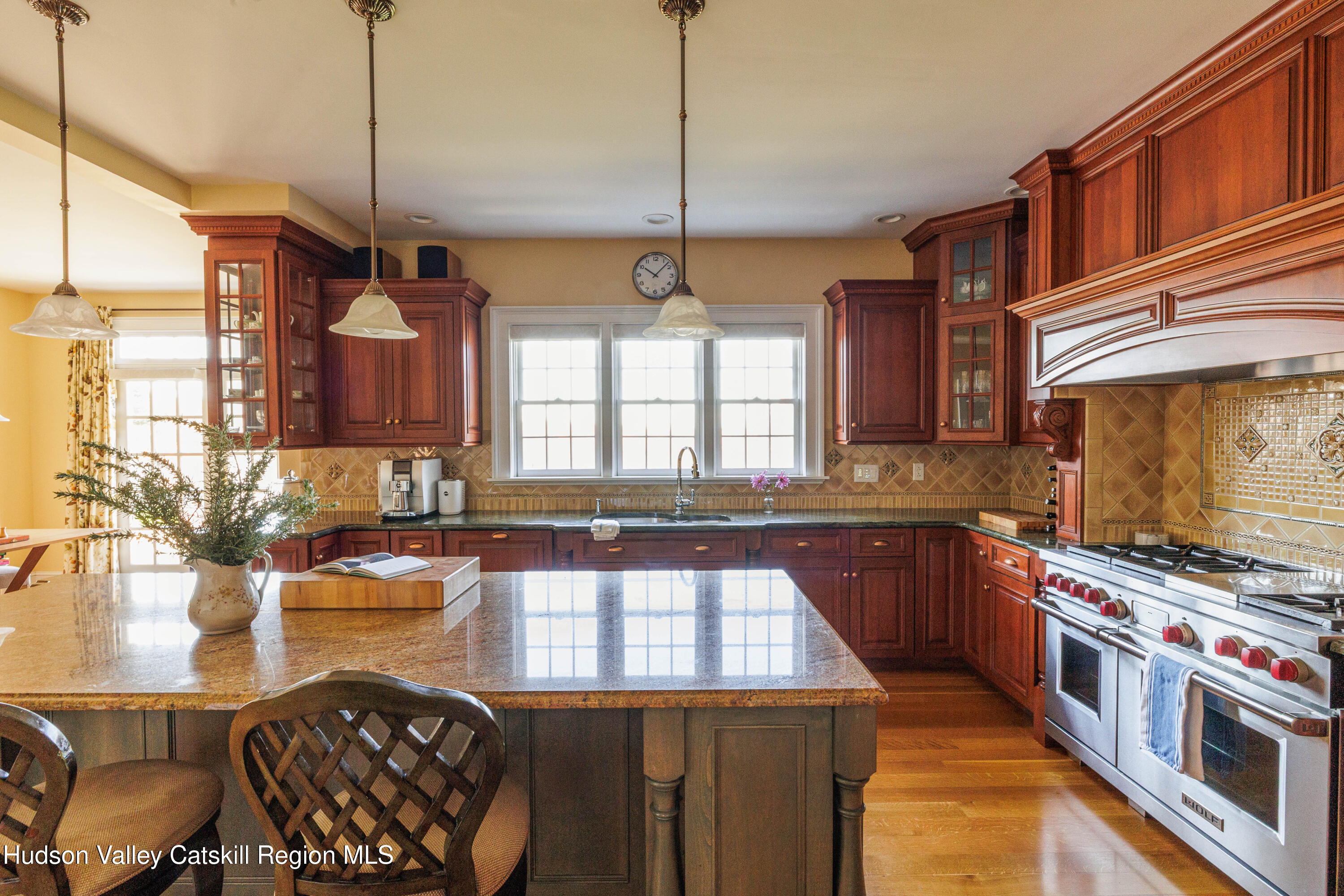 189 Sutherland Road Valatie, NY 12184 - Photo 21 of 94 a kitchen with stainless steel appliances granite countertop a stove a sink and a refrigerator