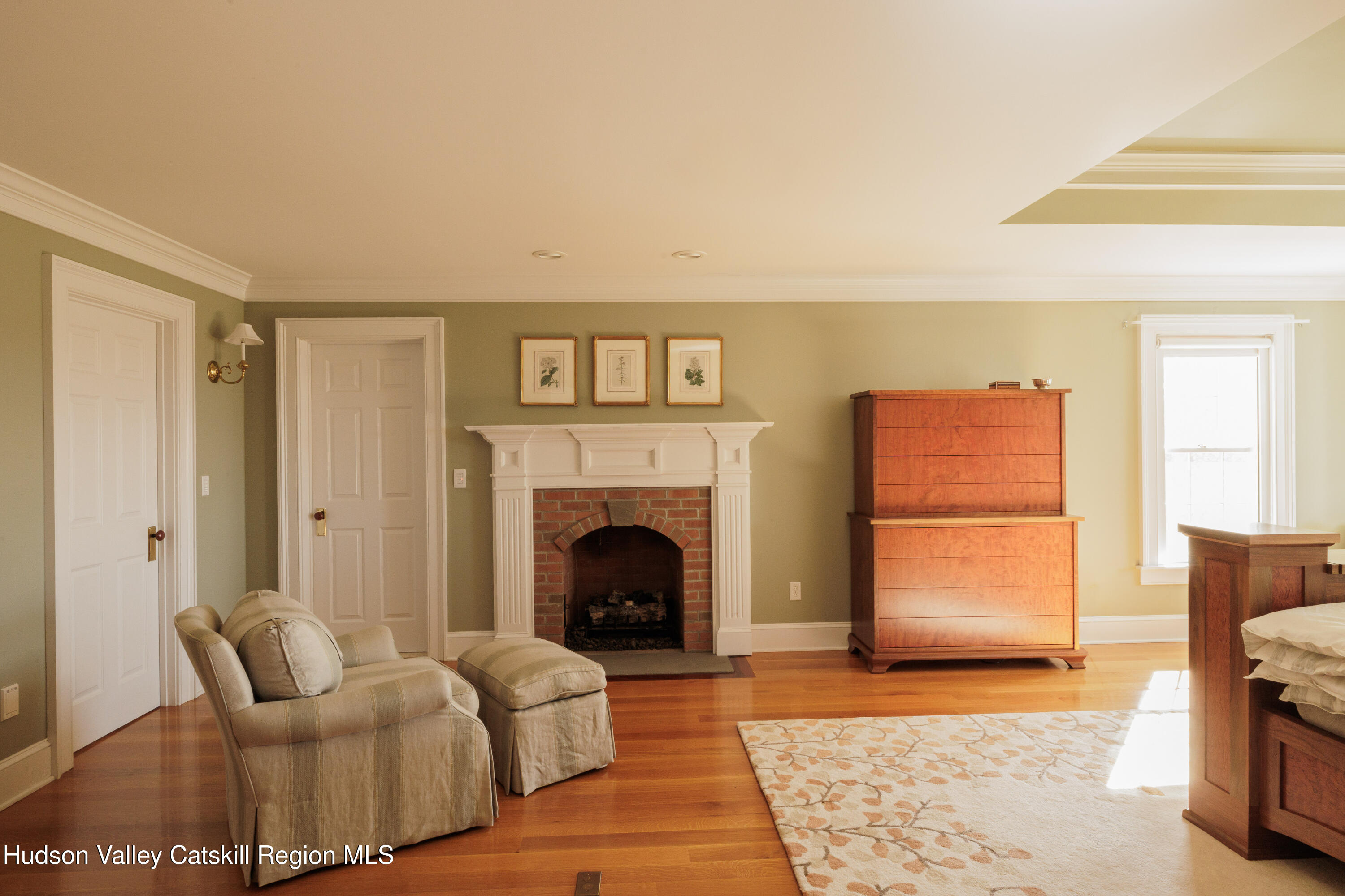 189 Sutherland Road Valatie, NY 12184 - Photo 36 of 94 a living room with furniture and a fireplace