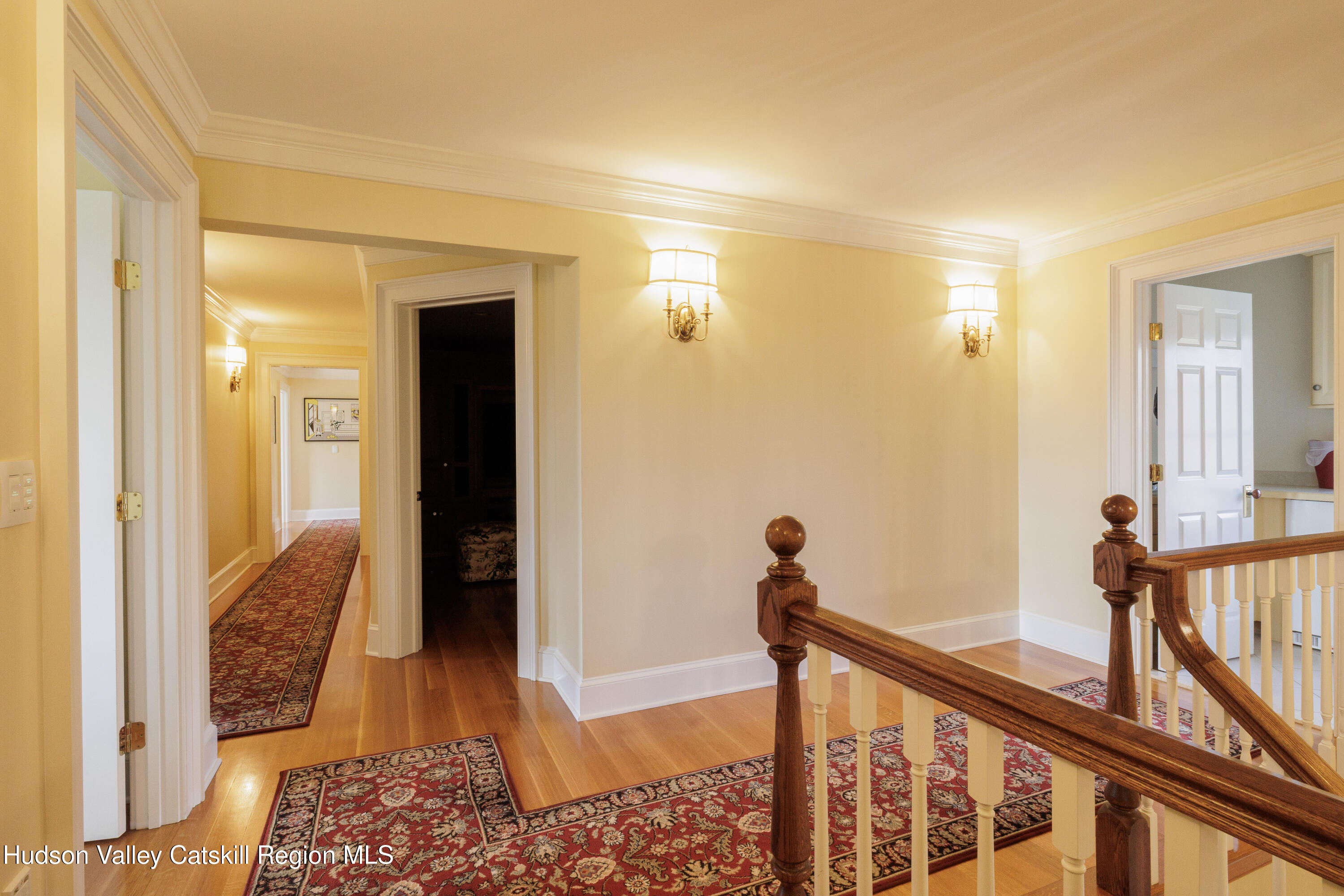 189 Sutherland Road Valatie, NY 12184 - Photo 39 of 94 a view of a hallway with wooden floor and staircase