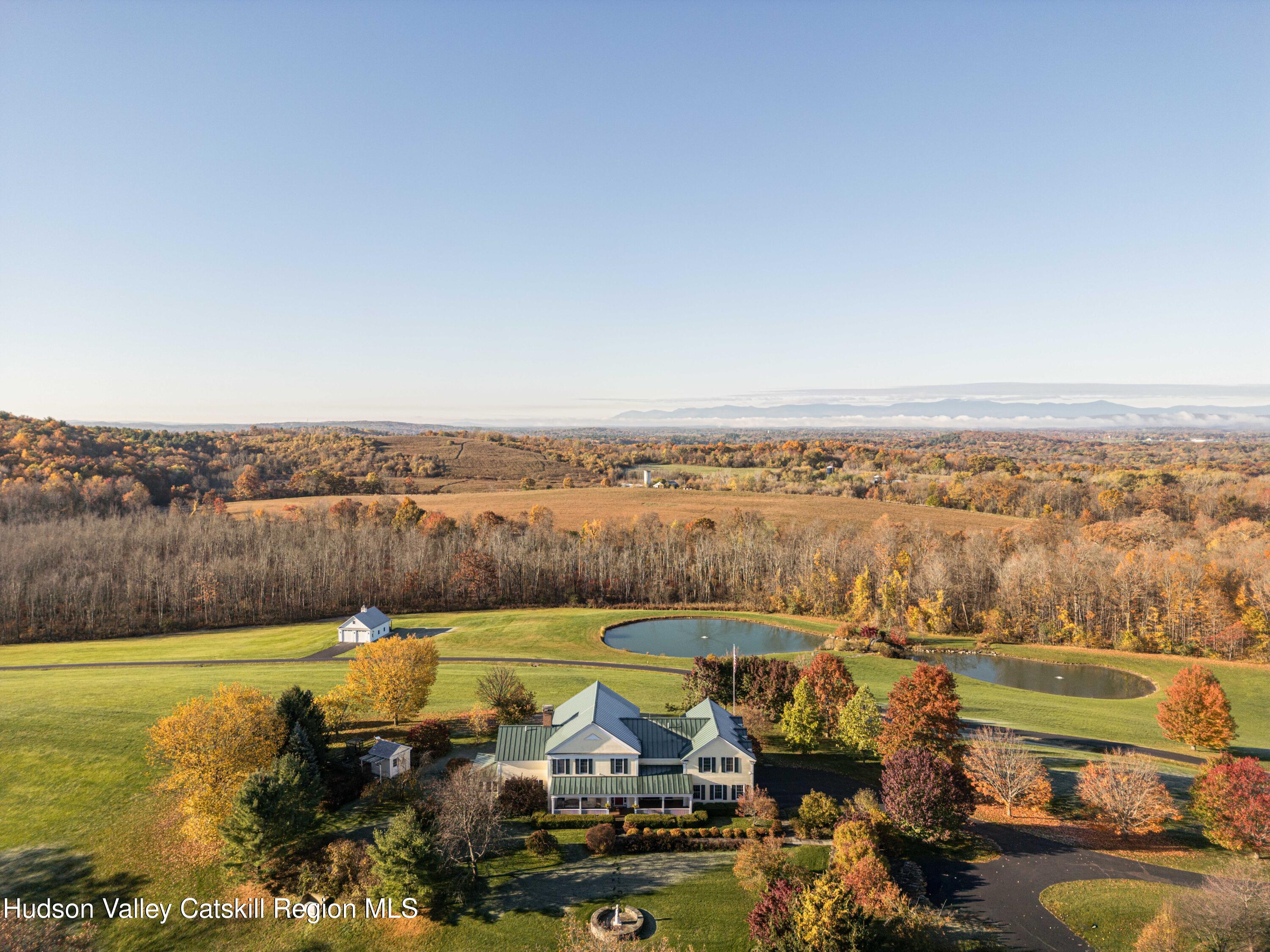 189 Sutherland Road Valatie, NY 12184 - Photo 75 of 94 a view of a lake with houses in the back