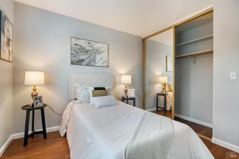 a bedroom with a bed and a table