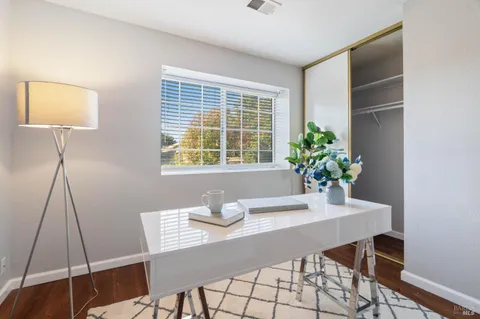 a workspace with furniture and wooden floor