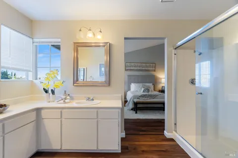 a bathroom with a sink double vanity and a mirror