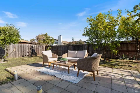 a view of a backyard with sitting area