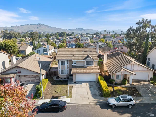 an aerial view of a house with a garden space