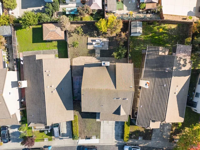 an aerial view of residential houses with outdoor space