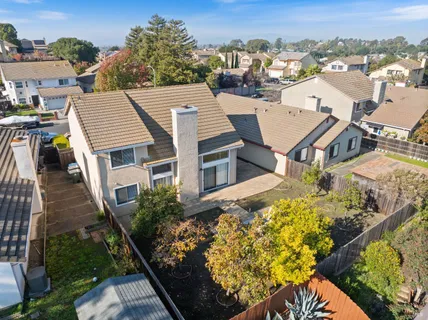 an aerial view of a residential apartment building with a yard