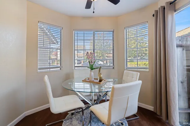 a dining room with furniture and window