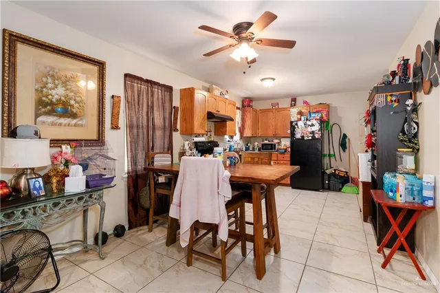 a view of a dining room with furniture and a chandelier