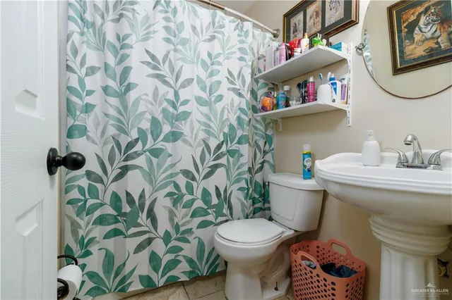 a bathroom with a toilet and a sink