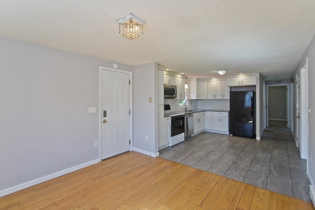 25 Driftwood Road Springfield, MA 01128 - Photo 5 of 21 a large kitchen with kitchen island a sink stainless steel appliances and cabinets