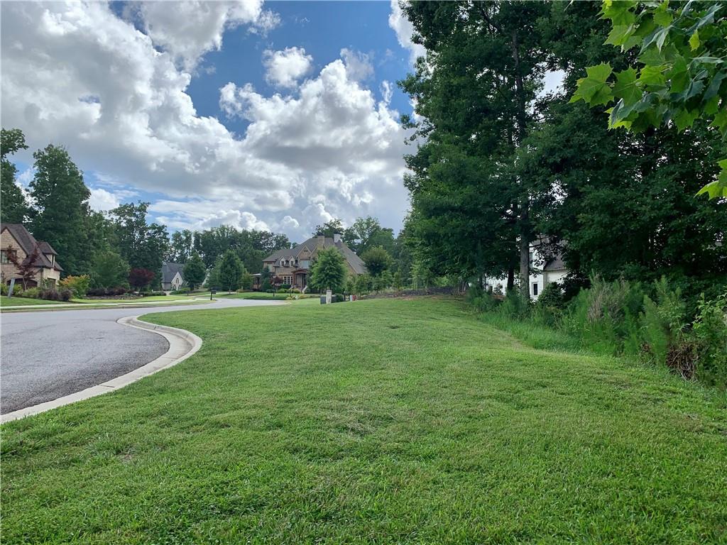 4920 Roaring Fork Pass Suwanee, GA 30024 - Photo 4 of 15 a view of grassy field with benches