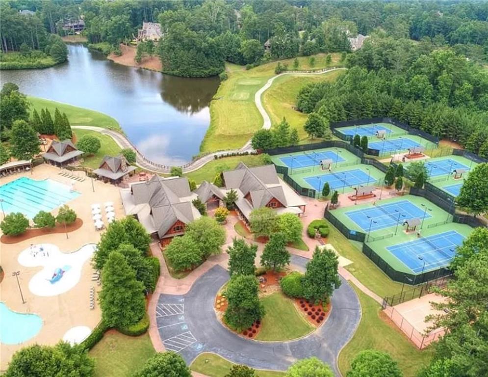 4920 Roaring Fork Pass Suwanee, GA 30024 - Photo 9 of 15 an aerial view of residential houses with outdoor space