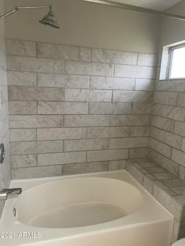 a kitchen with stainless steel appliances a sink a stove a microwave and cabinets