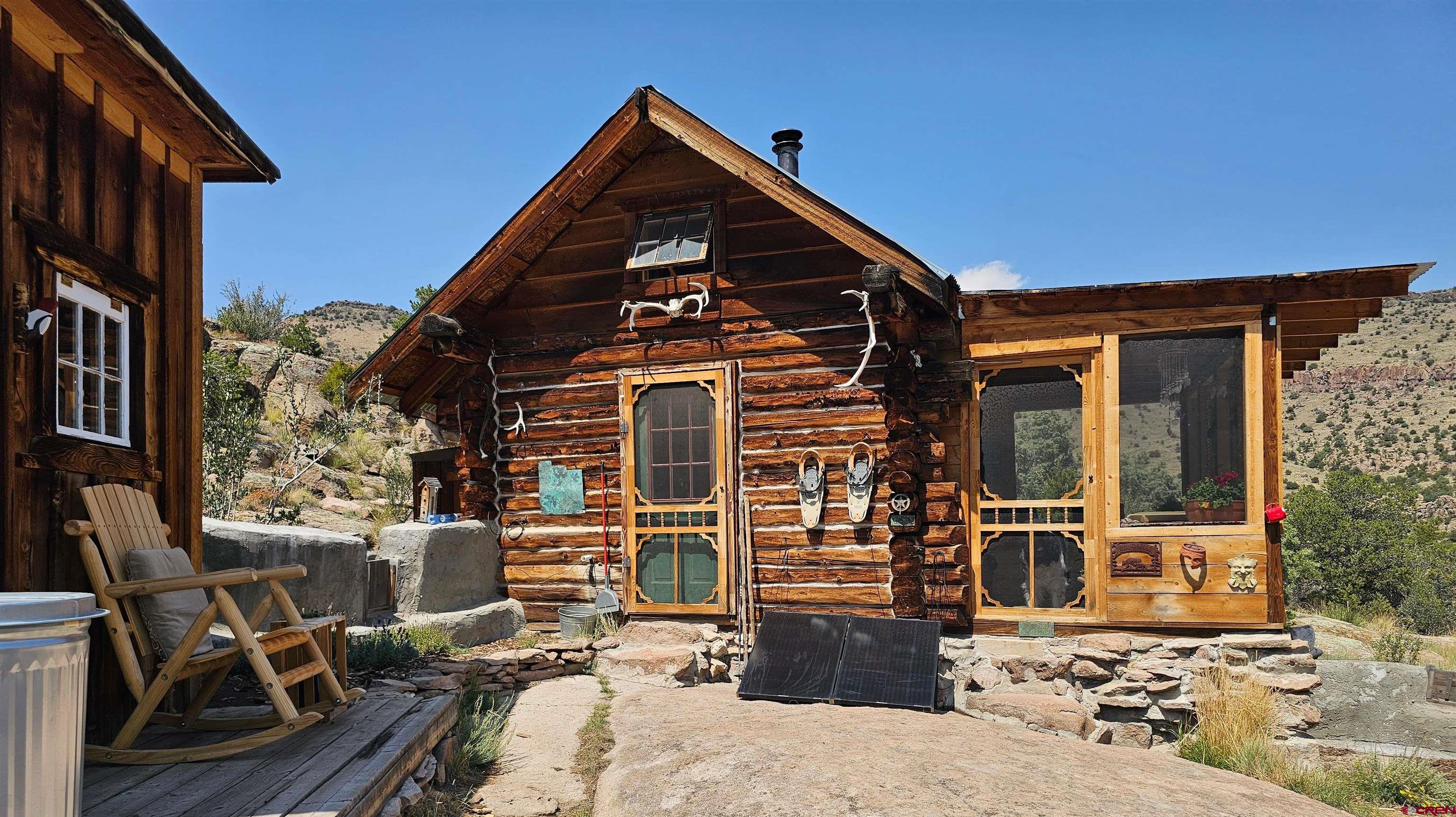 a view of backyard with a chair and the potted plant