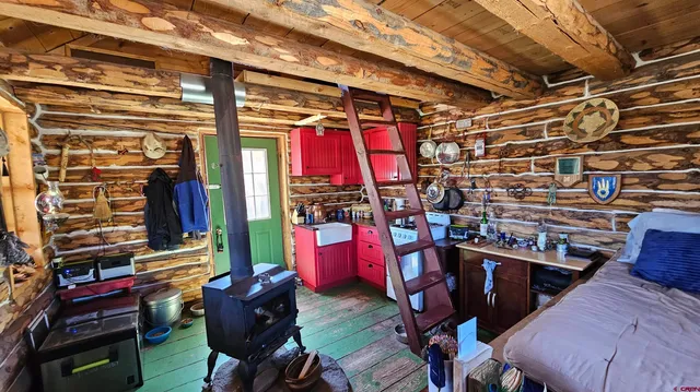 a view of a porch with furniture and a yard