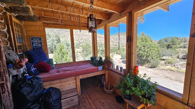a bedroom with a bed and teddy bear on the dresser