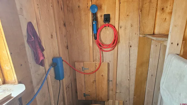 a bed room with a bed and a chair