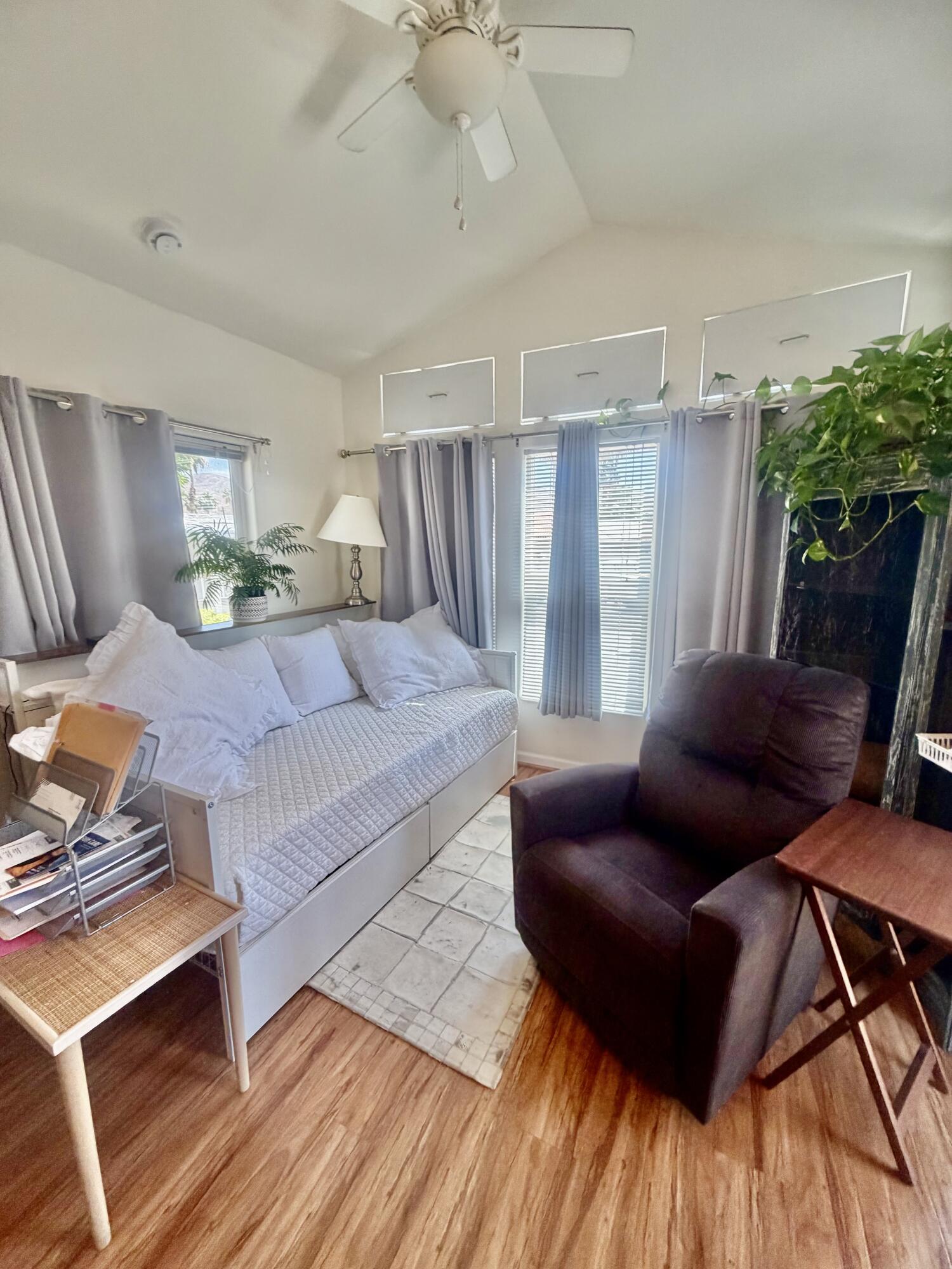 74711 Dillon Road, Unit 264 Desert Hot Springs, CA 92241 - Photo 12 of 21 a living room with furniture and wooden floor