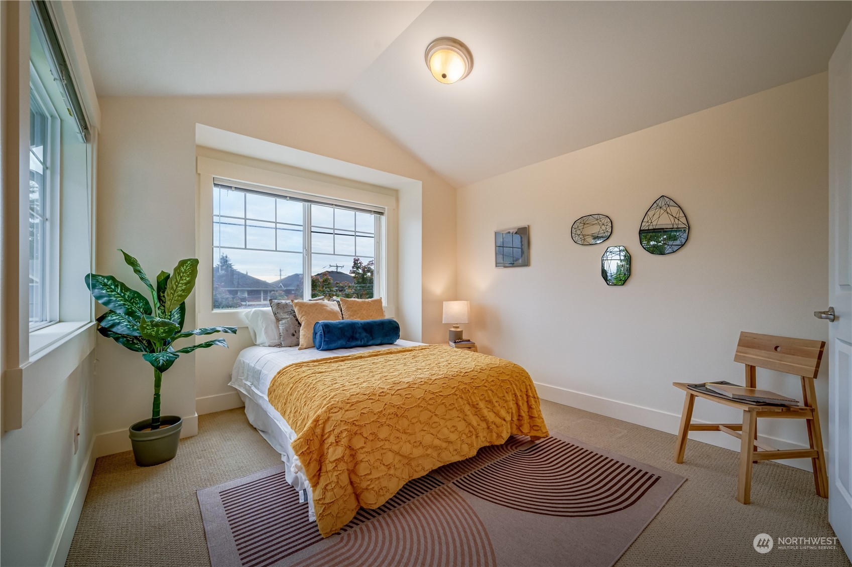 508 North 46th Street, Unit B Seattle, WA 98103 - Photo 21 of 30 a bedroom with a bed and window