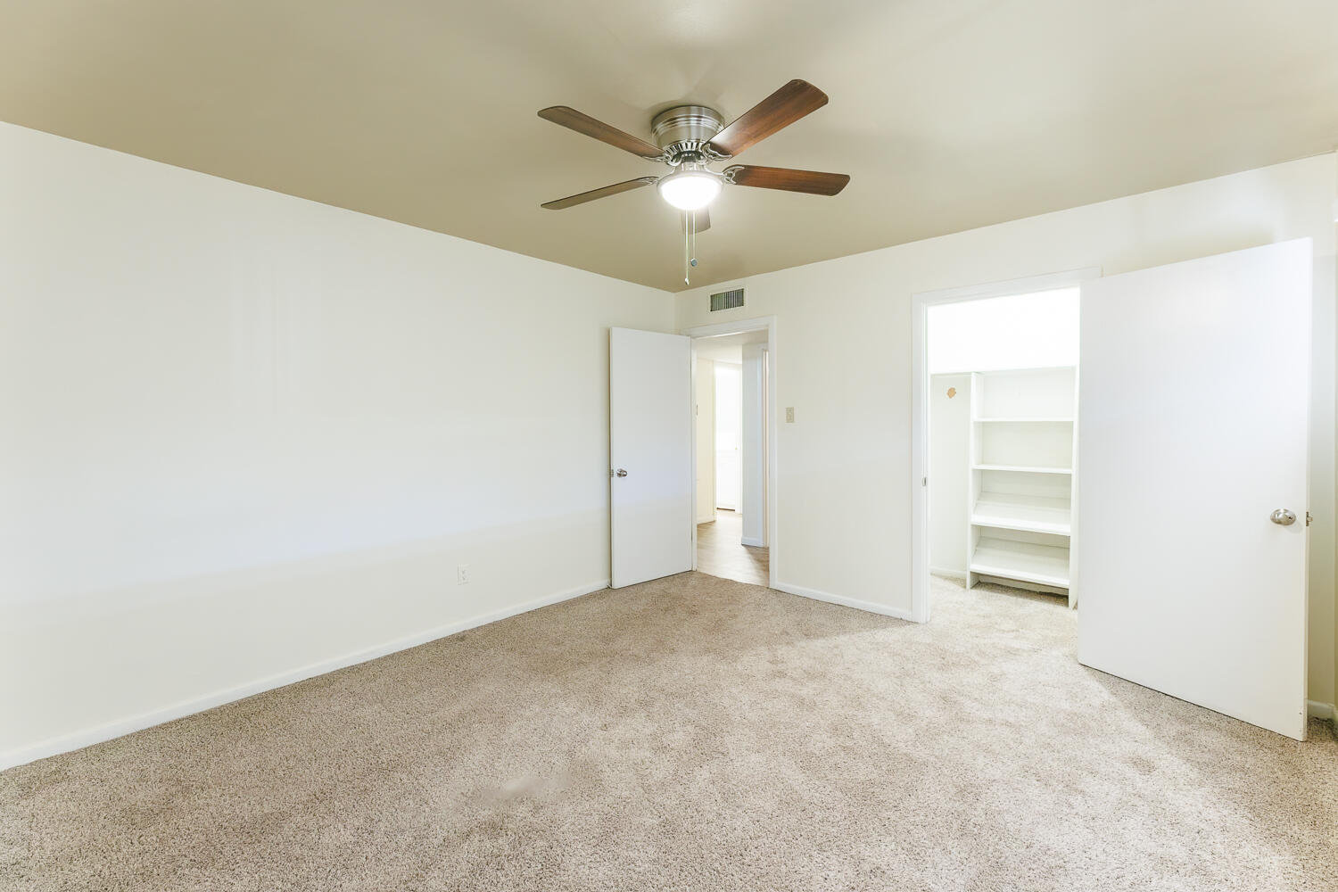 4319 40th Street Lubbock, TX 79413 - Photo 21 of 38 a view of an empty room with a ceiling fan