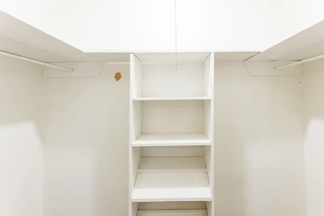 a view of a hallway with shelf