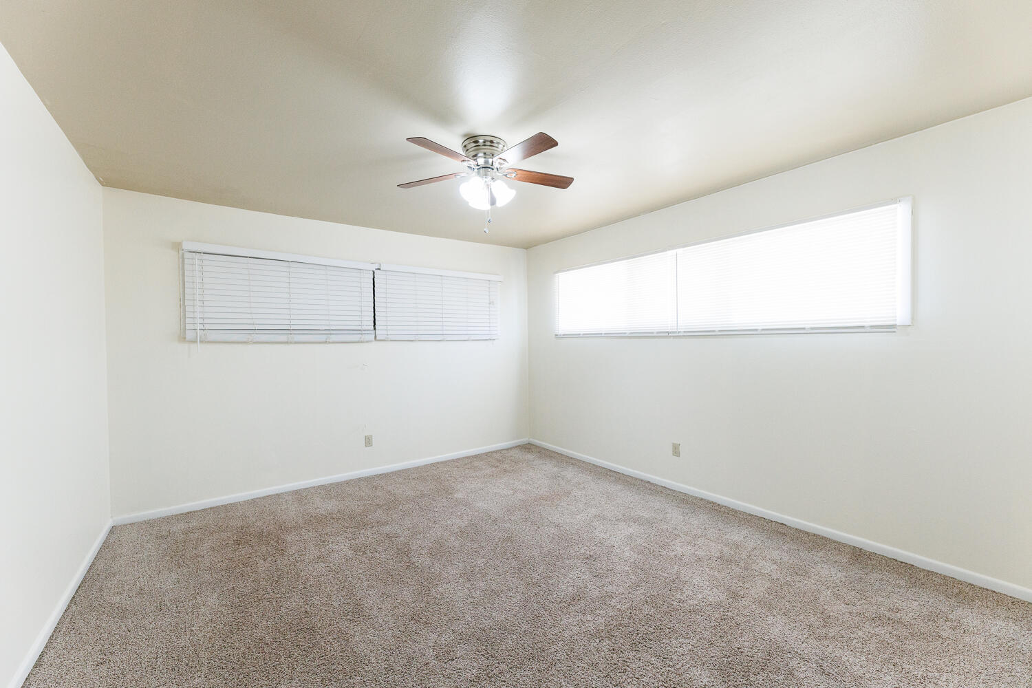 4319 40th Street Lubbock, TX 79413 - Photo 28 of 38 an empty room with a window and a ceiling fan