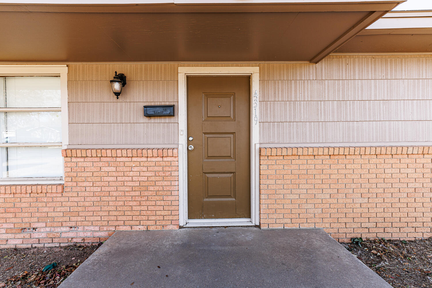 4319 40th Street Lubbock, TX 79413 - Photo 3 of 38 a view of a brick house with a small space