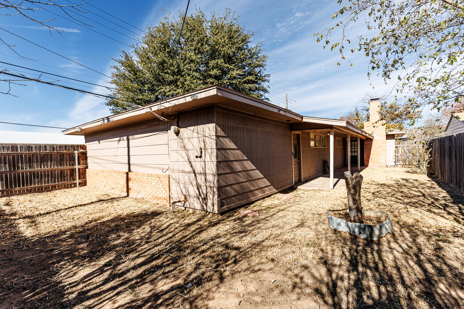 4319 40th Street Lubbock, TX 79413 - Photo 36 of 38 a view of a house with a snow in the yard