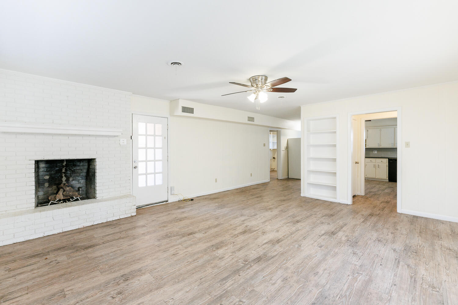 4319 40th Street Lubbock, TX 79413 - Photo 9 of 38 an empty room with windows and fireplace