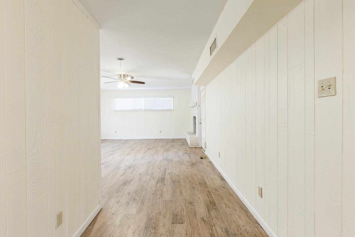 4319 40th Street Lubbock, TX 79413 - Photo 10 of 38 a view of a room with wooden floor